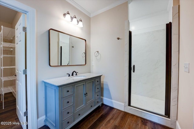 409 Kinnakeet Ln, New Bern, NC 28562 - full bathroom with wood finished floors, crown molding, vanity, a stall shower, and baseboards