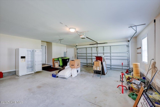 409 Kinnakeet Ln, New Bern, NC 28562 - garage with a garage door opener, electric panel, and baseboards