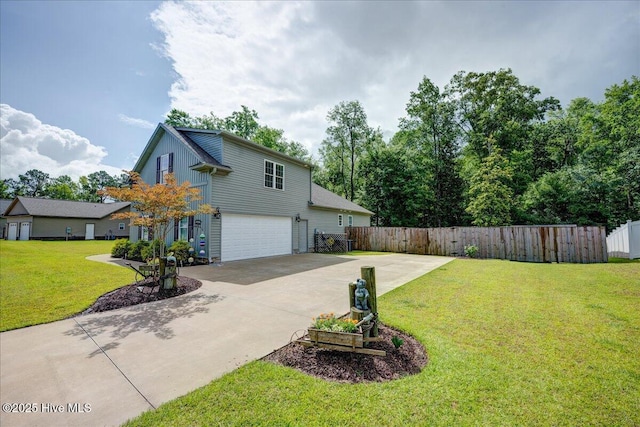409 Kinnakeet Ln, New Bern, NC 28562 - view of yard featuring concrete driveway and a garage