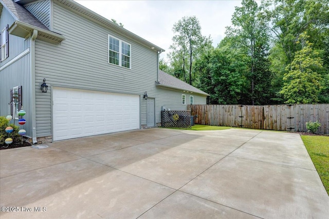 409 Kinnakeet Ln, New Bern, NC 28562 - view of home's exterior with a garage, driveway, and a shingled roof