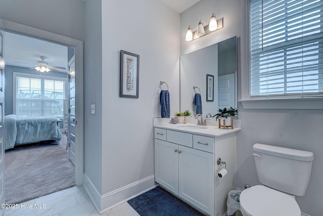 1279 Pandion Dr, Wilmington, NC 28411 - bathroom featuring vanity, marble finish flooring, ensuite bath, baseboards, and ceiling fan