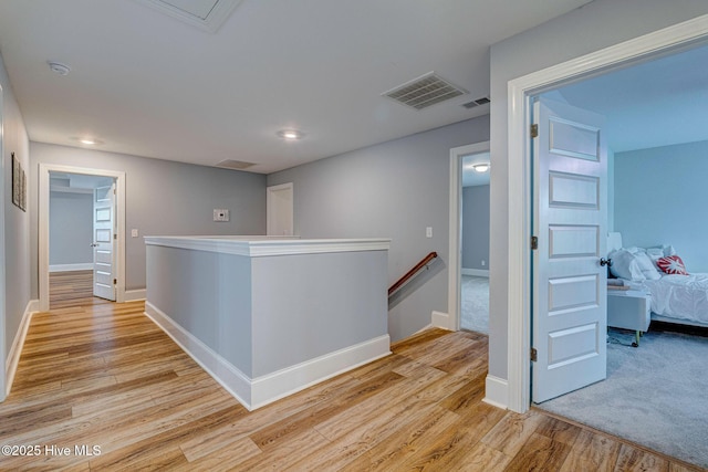 1279 Pandion Dr, Wilmington, NC 28411 - corridor with an upstairs landing, light wood-type flooring, baseboards, and recessed lighting