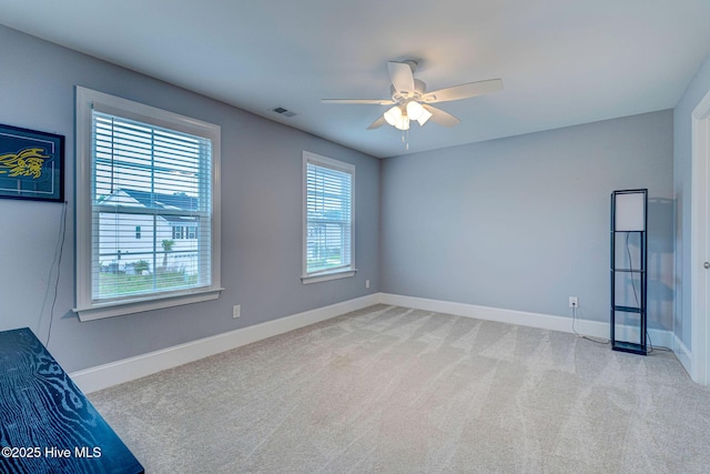 1279 Pandion Dr, Wilmington, NC 28411 - spare room featuring a ceiling fan, light colored carpet, and baseboards