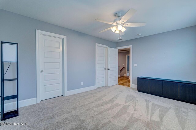 1279 Pandion Dr, Wilmington, NC 28411 - unfurnished bedroom with carpet flooring, baseboards, and a ceiling fan