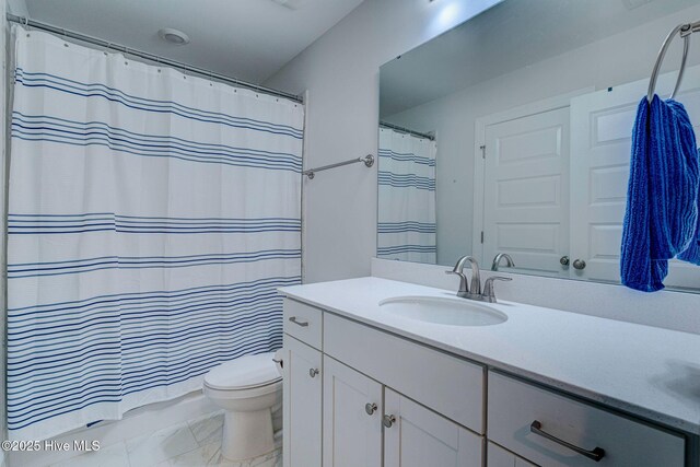 1279 Pandion Dr, Wilmington, NC 28411 - bathroom with vanity, toilet, and a shower with curtain