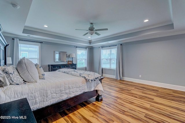 1279 Pandion Dr, Wilmington, NC 28411 - bedroom featuring a raised ceiling, crown molding, wood finished floors, baseboards, and recessed lighting