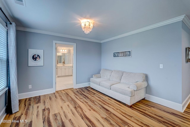 1279 Pandion Dr, Wilmington, NC 28411 - living room with wood finished floors, crown molding, and baseboards