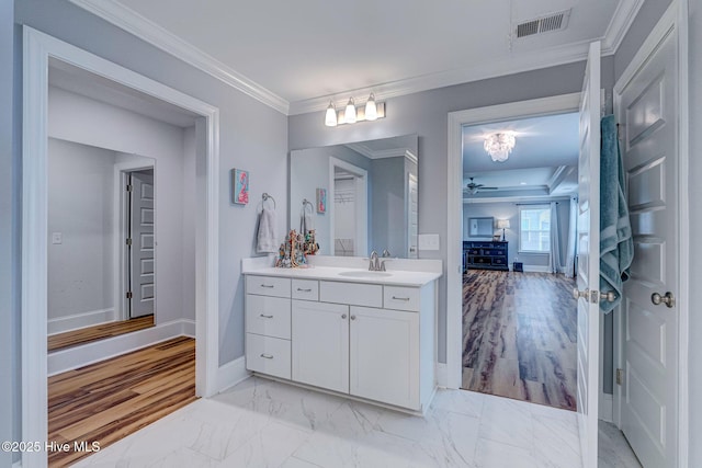 1279 Pandion Dr, Wilmington, NC 28411 - bathroom with vanity, baseboards, ornamental molding, marble finish flooring, and ceiling fan