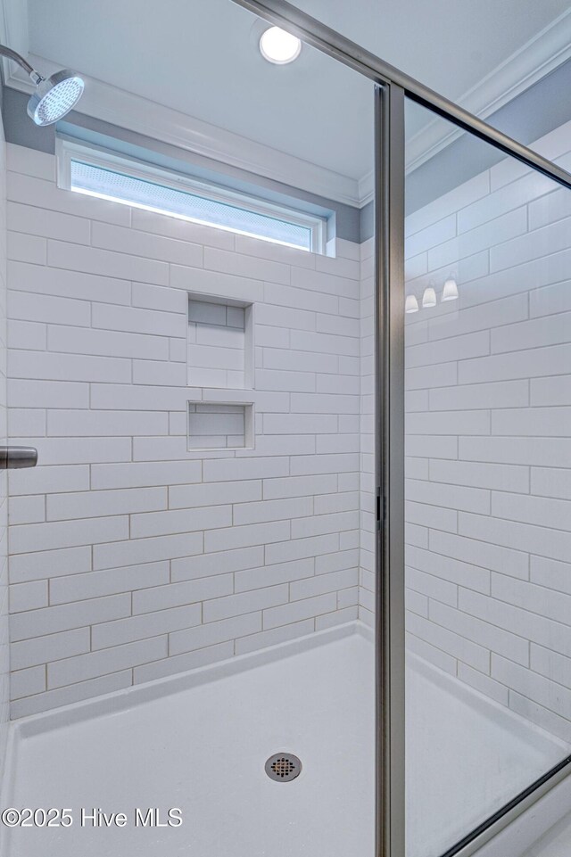 1279 Pandion Dr, Wilmington, NC 28411 - full bath featuring a stall shower, ornamental molding, and plenty of natural light