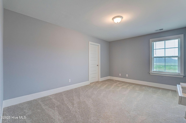 1279 Pandion Dr, Wilmington, NC 28411 - carpeted empty room featuring baseboards