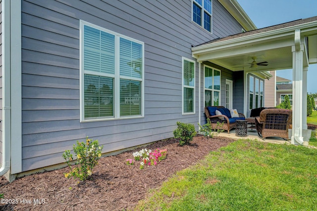 1279 Pandion Dr, Wilmington, NC 28411 - view of green lawn with outdoor lounge area, a ceiling fan, and a patio