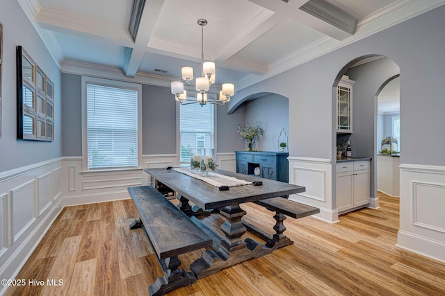 1279 Pandion Dr, Wilmington, NC 28411 - dining area featuring beamed ceiling, coffered ceiling, light wood-style flooring, a decorative wall, and a chandelier