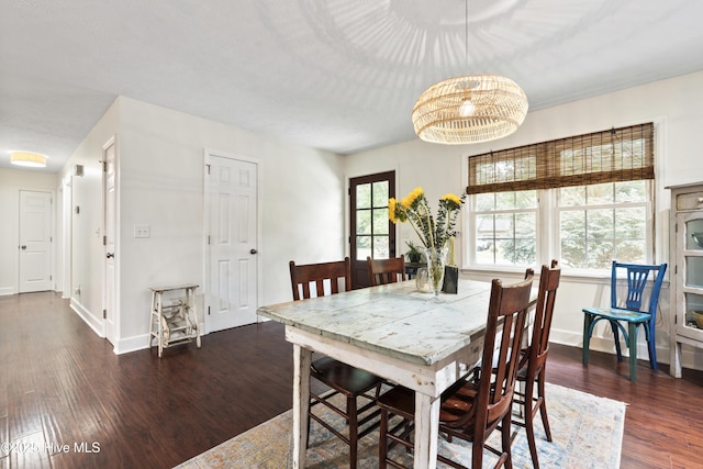 109 Dilworth Rd, Wilmington, NC 28411 - dining room featuring dark wood-type flooring, baseboards, and a chandelier