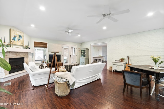 109 Dilworth Rd, Wilmington, NC 28411 - living area with a fireplace, a ceiling fan, wood finished floors, recessed lighting, and brick wall