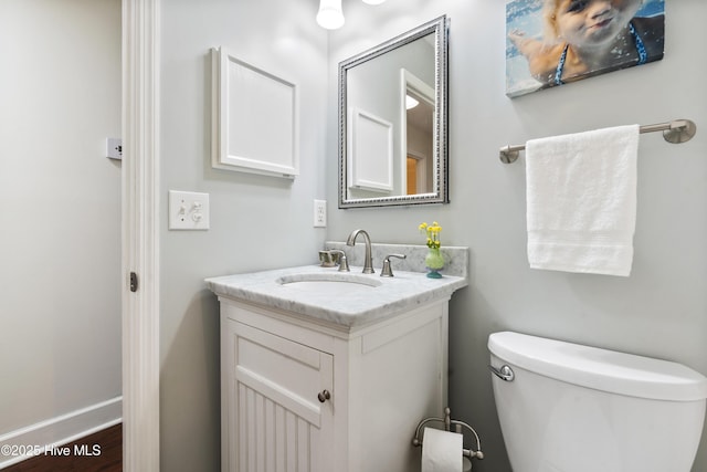 109 Dilworth Rd, Wilmington, NC 28411 - half bath featuring vanity, toilet, and wood finished floors