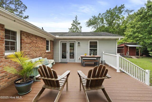 109 Dilworth Rd, Wilmington, NC 28411 - wooden deck featuring french doors, an outdoor hangout area, and a lawn