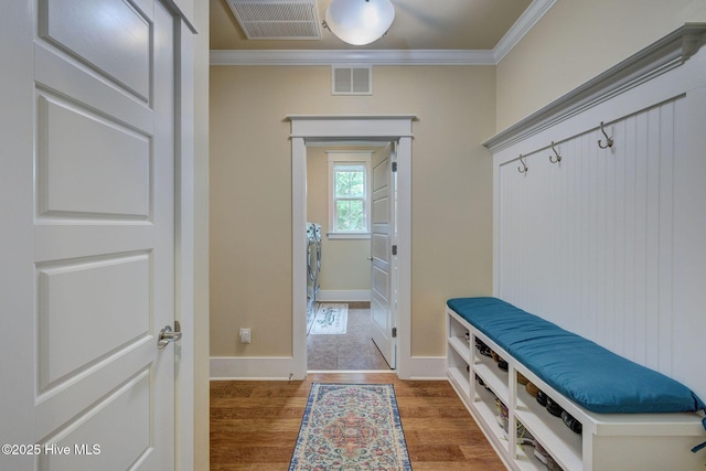 7406 Songbird Ct, Wilmington, NC 28411 - mudroom with ornamental molding, wood finished floors, and baseboards