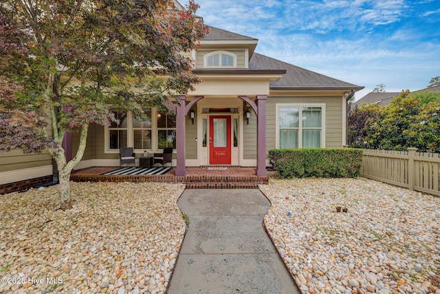 7406 Songbird Ct, Wilmington, NC 28411 - view of front of house with covered porch and roof with shingles