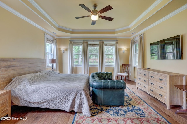 7406 Songbird Ct, Wilmington, NC 28411 - bedroom with a raised ceiling, crown molding, wood finished floors, and a ceiling fan
