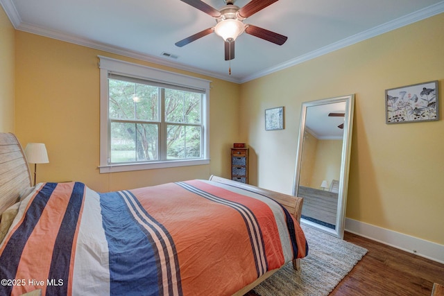 7406 Songbird Ct, Wilmington, NC 28411 - bedroom with baseboards, wood finished floors, crown molding, and ceiling fan