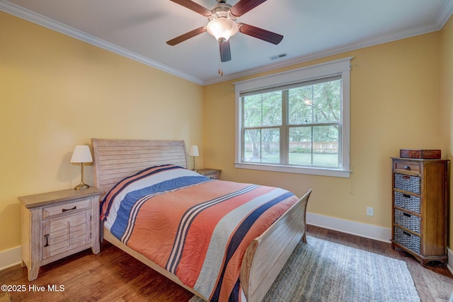 7406 Songbird Ct, Wilmington, NC 28411 - bedroom featuring baseboards, crown molding, wood finished floors, and ceiling fan