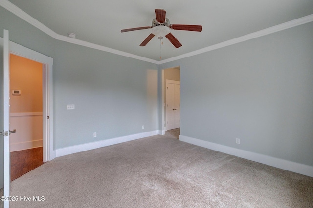 7406 Songbird Ct, Wilmington, NC 28411 - unfurnished room featuring ornamental molding, carpet, a ceiling fan, baseboards, and a smoke detector