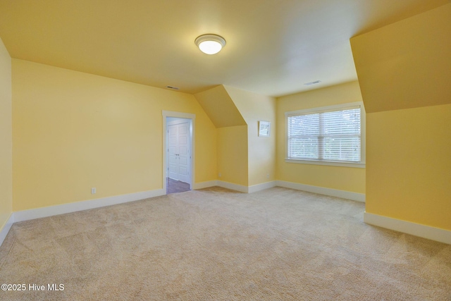 7406 Songbird Ct, Wilmington, NC 28411 - additional living space with carpet, baseboards, and vaulted ceiling