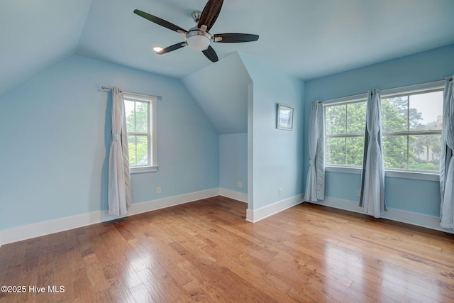 7406 Songbird Ct, Wilmington, NC 28411 - bonus room featuring ceiling fan, lofted ceiling, light wood-style floors, and baseboards
