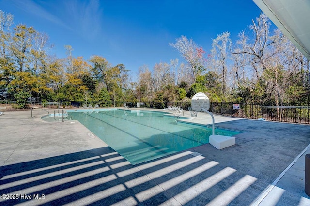 7406 Songbird Ct, Wilmington, NC 28411 - community pool with a patio and view of wooded area