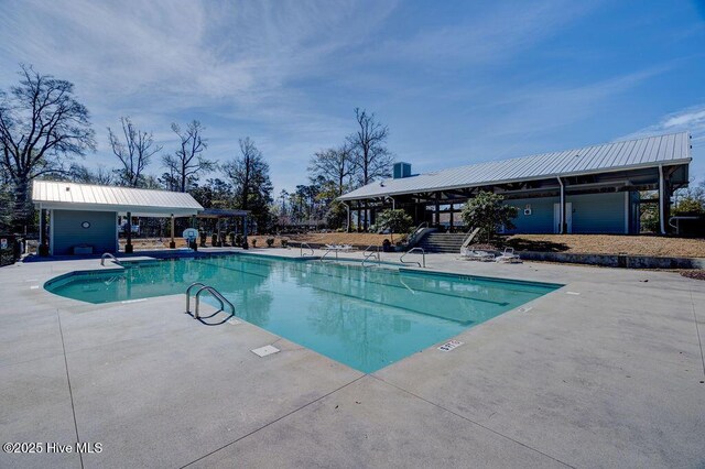 7406 Songbird Ct, Wilmington, NC 28411 - community pool with a patio and stairway