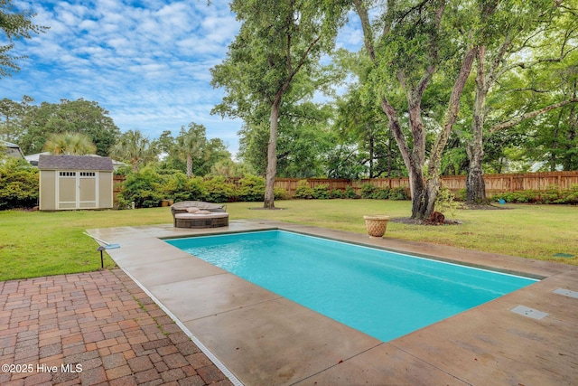 7406 Songbird Ct, Wilmington, NC 28411 - view of swimming pool with a patio area, an outdoor fire pit, and view of wooded area