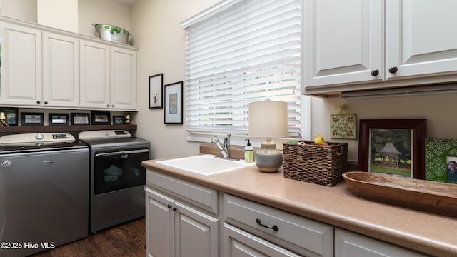 370 Lake Dornoch Dr, Pinehurst, NC 28374 - laundry room featuring independent washer and dryer, cabinet space, and dark wood-style flooring