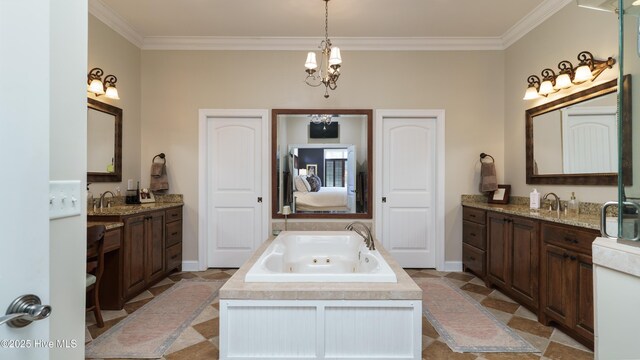 370 Lake Dornoch Dr, Pinehurst, NC 28374 - full bathroom featuring ornamental molding, a jetted tub, two vanities, a chandelier, and baseboards