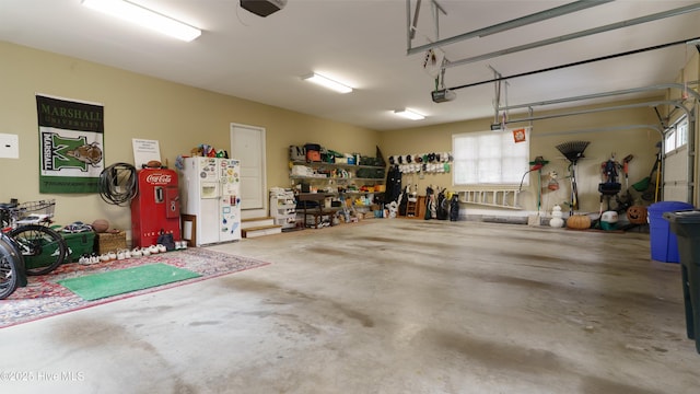 370 Lake Dornoch Dr, Pinehurst, NC 28374 - garage with white fridge with ice dispenser and a garage door opener