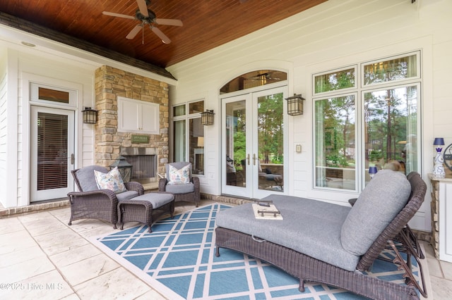 370 Lake Dornoch Dr, Pinehurst, NC 28374 - view of patio with french doors, a ceiling fan, and an outdoor living space with a fireplace