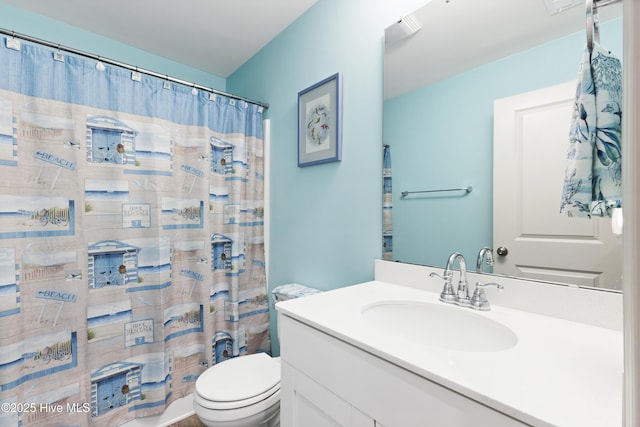 940 Pine Needles Rd, Southport, NC 28461 - bathroom featuring toilet, vanity, and a shower with shower curtain