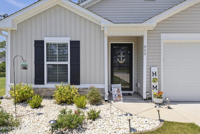 940 Pine Needles Rd, Southport, NC 28461 - view of exterior entry with board and batten siding and a garage