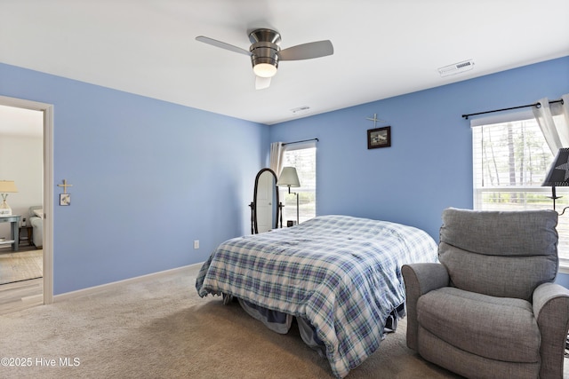 940 Pine Needles Rd, Southport, NC 28461 - carpeted bedroom featuring a ceiling fan and baseboards