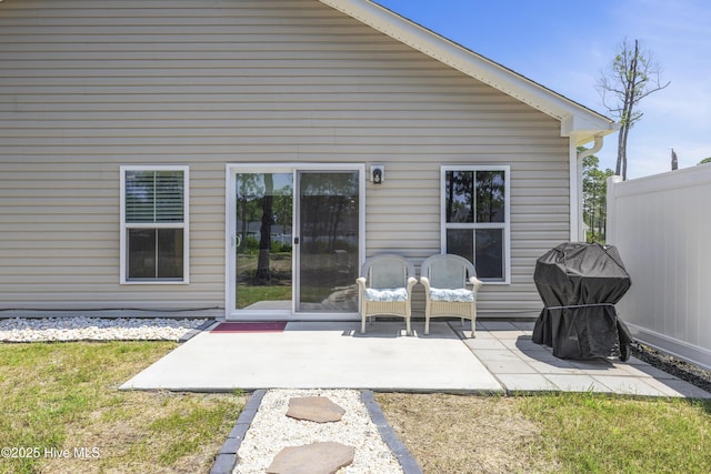 940 Pine Needles Rd, Southport, NC 28461 - rear view of house featuring a patio