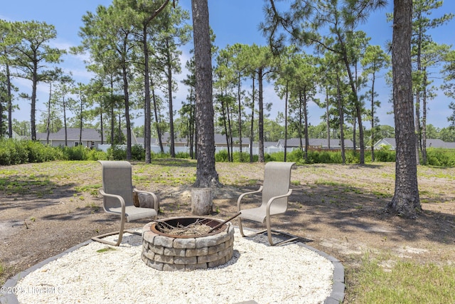 940 Pine Needles Rd, Southport, NC 28461 - view of patio with a fire pit
