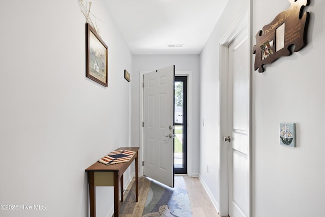940 Pine Needles Rd, Southport, NC 28461 - foyer with light wood-style flooring and baseboards