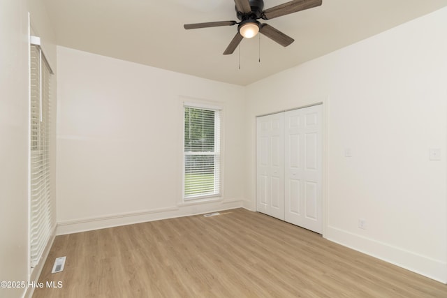502 Sterlingworth St, Windsor, NC 27983 - unfurnished bedroom with light wood-style floors, baseboards, a closet, and ceiling fan