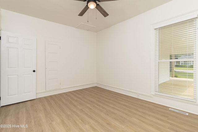 502 Sterlingworth St, Windsor, NC 27983 - empty room with light wood-style flooring, attic access, a ceiling fan, and baseboards