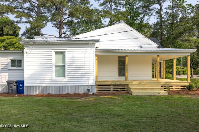 502 Sterlingworth St, Windsor, NC 27983 - view of front facade with a front yard, metal roof, and covered porch