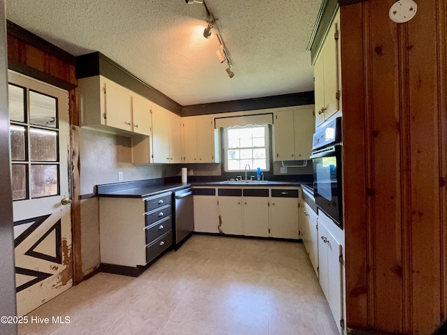 5 Keys Cross Rd, Hobbsville, NC 27946 - kitchen featuring stainless steel dishwasher, black oven, a sink, a textured ceiling, and dark countertops