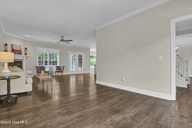 1113 Foxbow Cv, Leland, NC 28451 - living area with wood finished floors, ornamental molding, ceiling fan, a fireplace, and baseboards