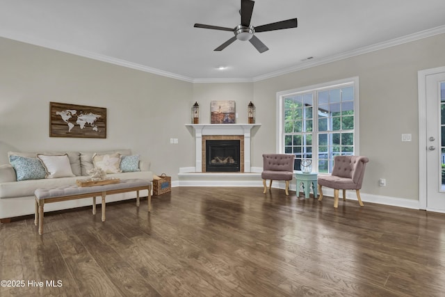 1113 Foxbow Cv, Leland, NC 28451 - living area featuring ornamental molding, wood finished floors, baseboards, a ceiling fan, and a fireplace