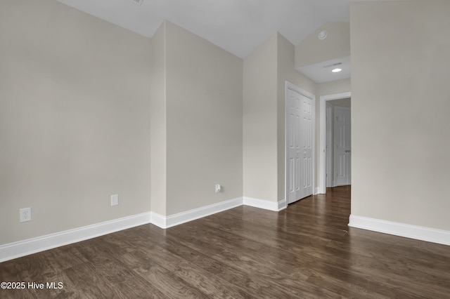 1113 Foxbow Cv, Leland, NC 28451 - empty room featuring wood finished floors, baseboards, and lofted ceiling