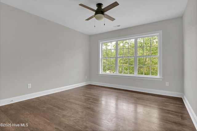 1113 Foxbow Cv, Leland, NC 28451 - unfurnished room featuring baseboards, a ceiling fan, and dark wood finished floors
