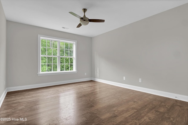 1113 Foxbow Cv, Leland, NC 28451 - unfurnished room featuring baseboards, a ceiling fan, and dark wood finished floors